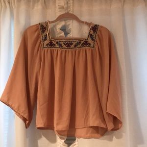 Flying tomato flowy cropped blouse